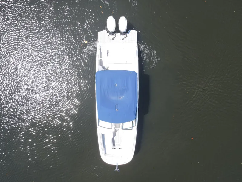Slide: The Image of Overhead view of 2021 Sea Ray SDX 290 Outboard boat on water. - 18