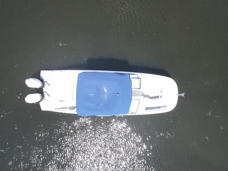 Slide: The Image of Overhead view of 2021 Sea Ray SDX 290 Outboard boat on water. - 19