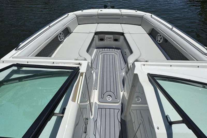 Slide: The Image of 2021 Sea Ray SDX 290 Outboard boat interior with spacious seating and sleek design. - 21
