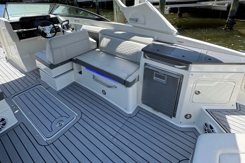 Slide: The Image of 2021 Sea Ray SDX 290 Outboard interior with seating and modern amenities. - 22