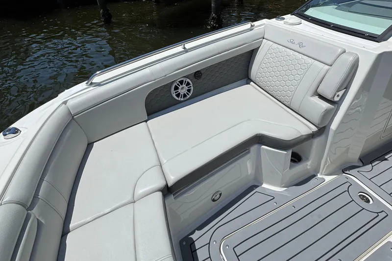 Slide: The Image of 2021 Sea Ray SDX 290 Outboard boat interior with luxurious seating and speaker. - 24