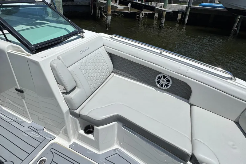 Slide: The Image of 2021 Sea Ray SDX 290 Outboard boat interior with cushioned seating and speaker. - 25