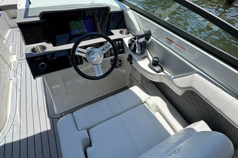 Slide: The Image of 2021 Sea Ray SDX 290 Outboard helm with modern controls and sleek design. - 27