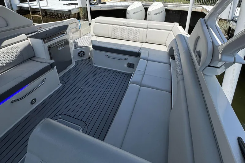 Slide: The Image of 2021 Sea Ray SDX 290 Outboard interior with spacious seating and modern design. - 32