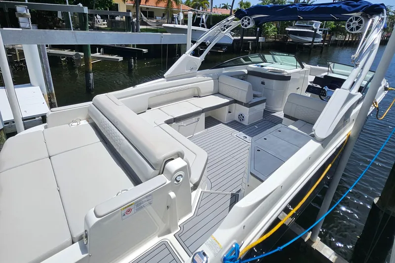 Slide: The Image of 2021 Sea Ray SDX 290 Outboard boat with spacious seating and sleek design docked at marina. - 43