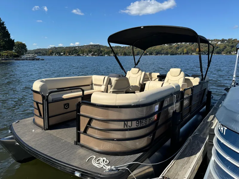 The Image of 2023 Godfrey SWEETWATER 2186 SB pontoon boat docked on a sunny lake. - 0