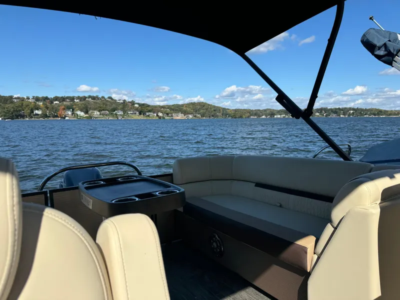 Slide: The Image of 2023 Godfrey SWEETWATER 2186 SB pontoon boat on a scenic lake. - 10