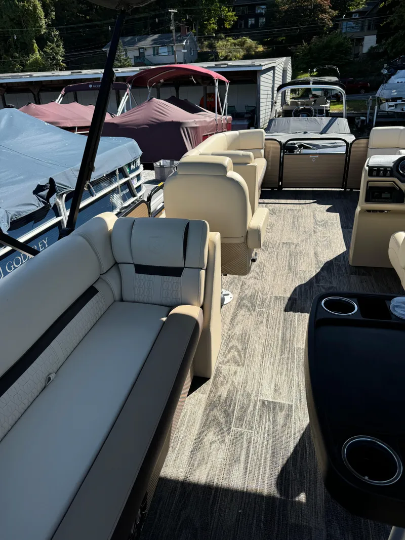 Slide: The Image of 2023 Godfrey SWEETWATER 2186 SB pontoon boat interior with beige seating and modern design. - 12
