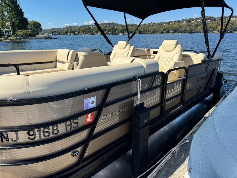 Slide: The Image of 2023 Godfrey SWEETWATER 2186 SB pontoon boat docked on a scenic lake. - 3