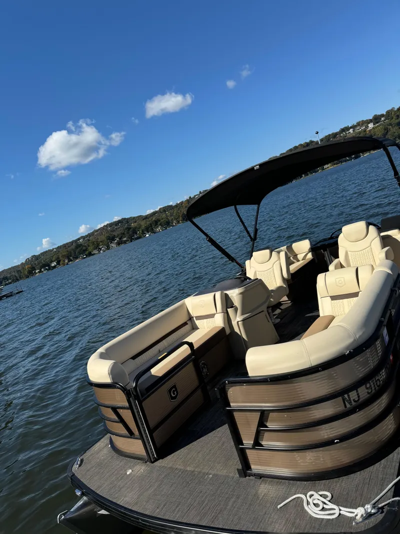 Slide: The Image of 2023 Godfrey SWEETWATER 2186 SB pontoon boat on a scenic lake. - 4