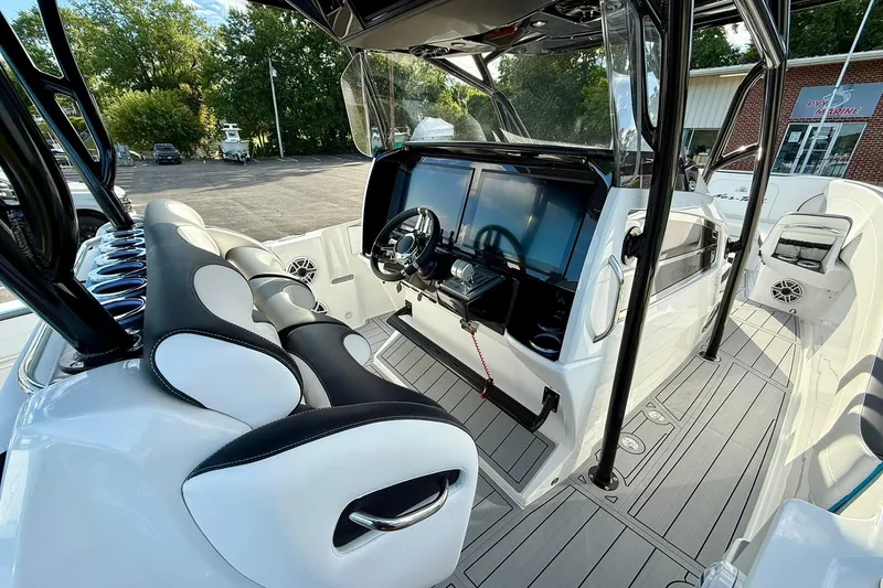 Slide: The Image of 2026 Nor-Tech 340 Sport boat interior with modern dashboard and seating. - 5