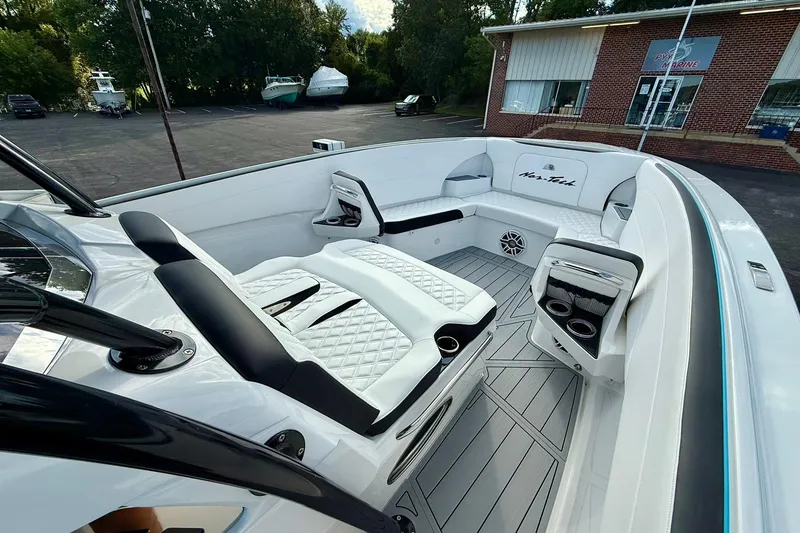 Slide: The Image of 2026 Nor-Tech 340 Sport boat interior with luxurious seating and modern design. - 6