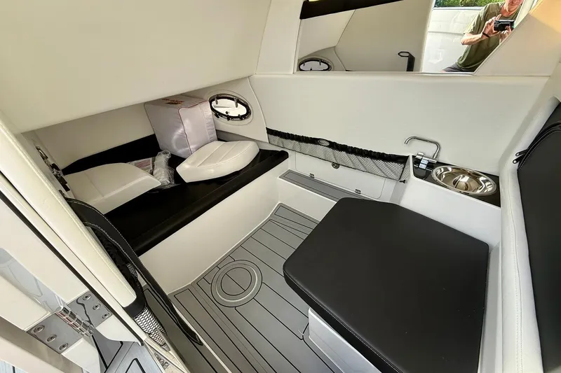 Slide: The Image of Interior of 2026 Nor-Tech 340 Sport boat with seating and sink. - 8