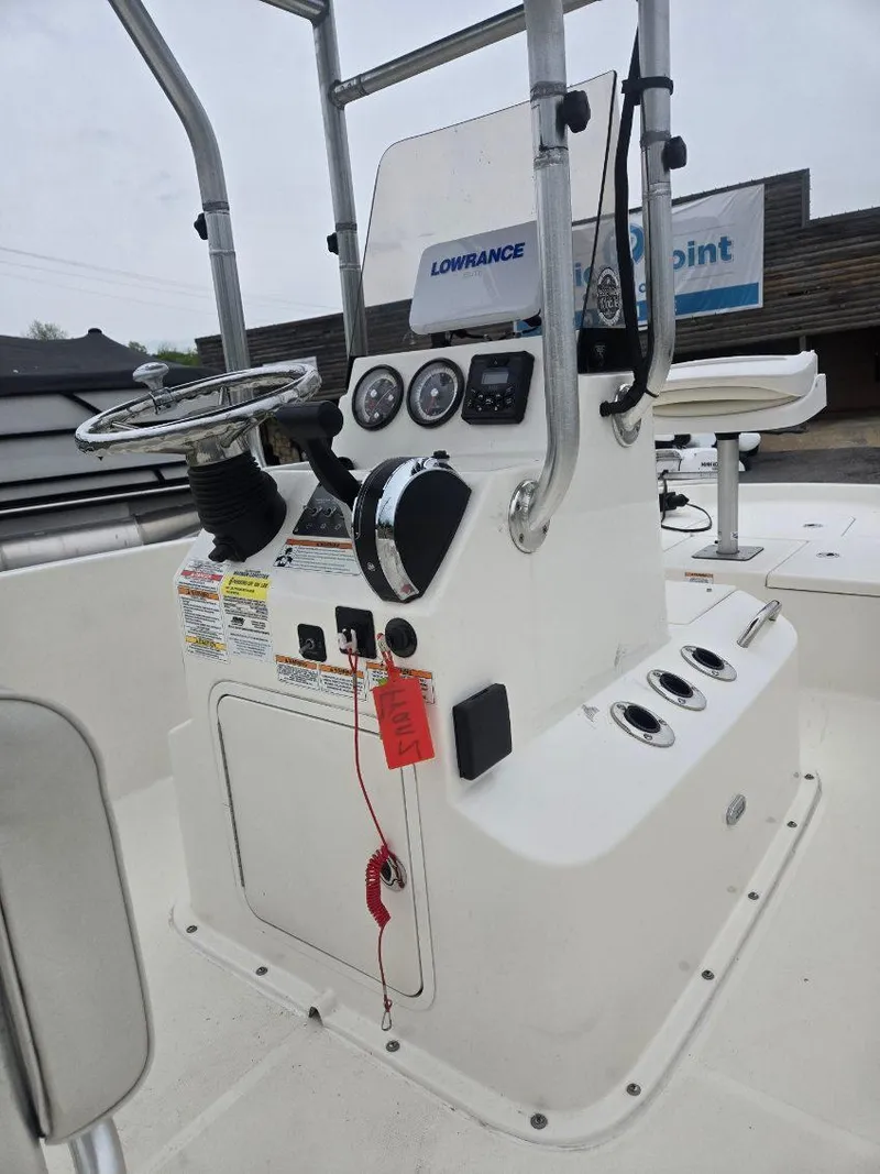 Slide: The Image of 2022 Bayliner Trophy T18Bay boat console with steering wheel and controls. - 6