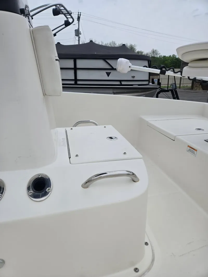 Slide: The Image of 2022 Bayliner Trophy T18Bay boat interior with storage compartments and seating. - 9