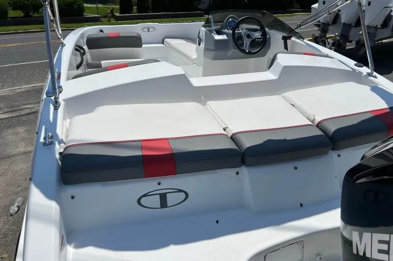 Slide: The Image of 2021 Tahoe T16 boat with Mercury engine on trailer, parked outdoors. - 4