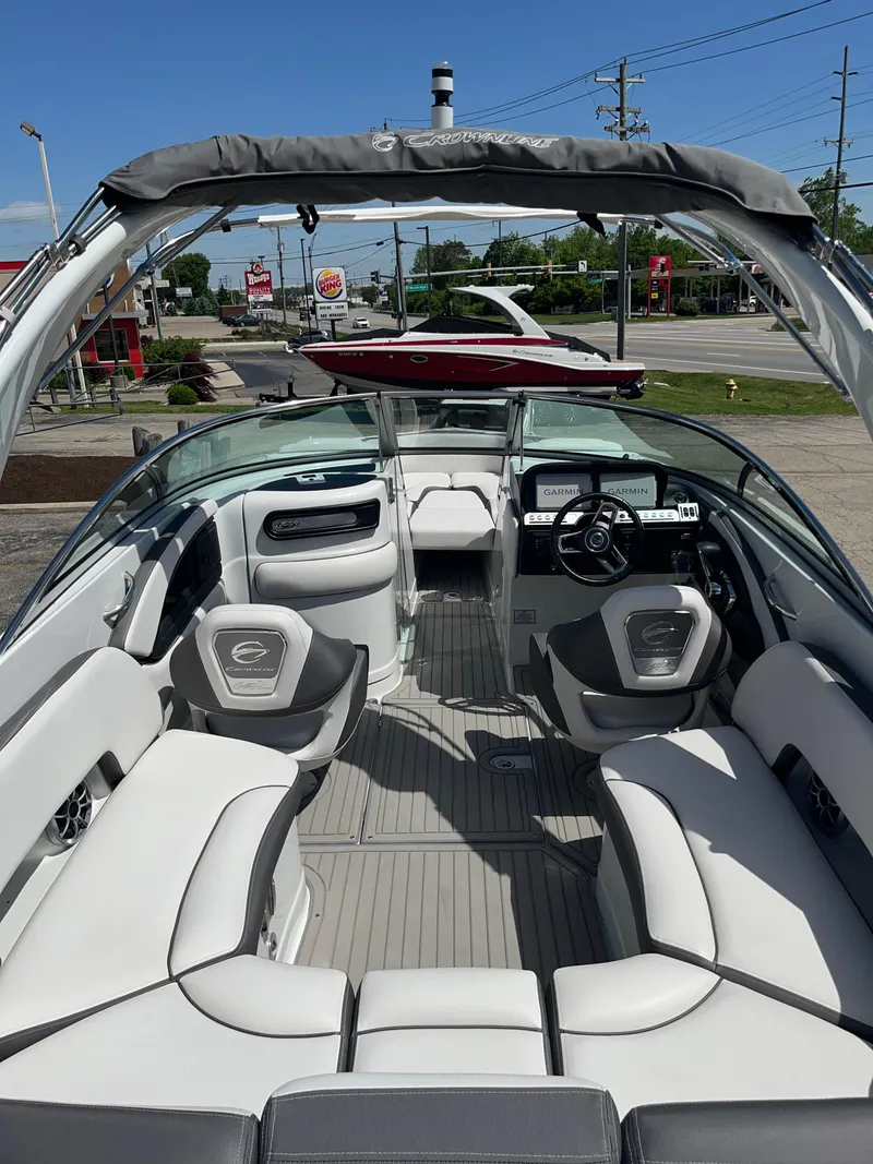 Slide: The Image of 2024 Crownline 270 SS boat interior with modern seating and dashboard. - 2