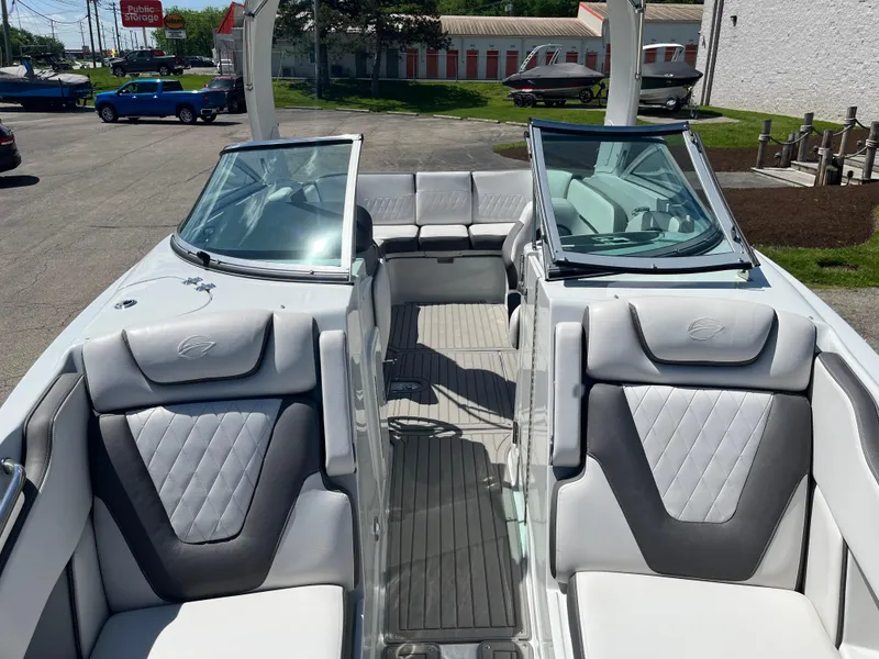 Slide: The Image of 2024 Crownline 270 SS boat interior with gray seating and open windshield. - 3