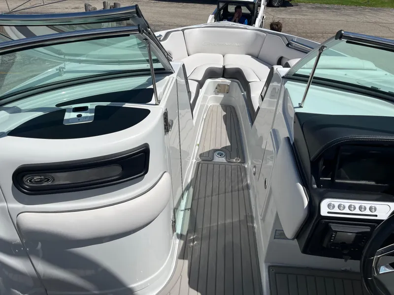 Slide: The Image of 2024 Crownline 270 SS boat interior with sleek seating and modern dashboard design. - 9