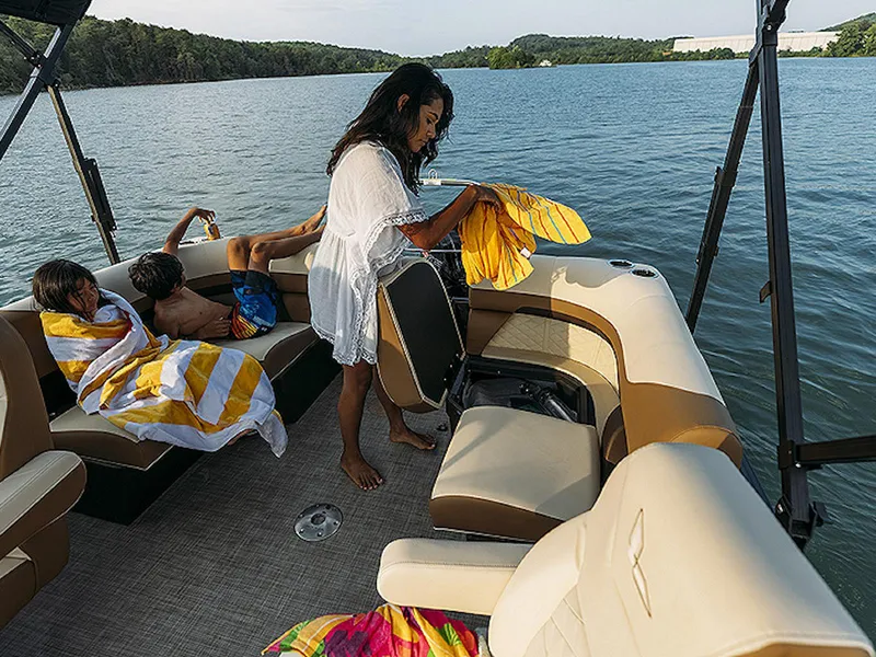 Slide: The Image of Family enjoying a day on a 2024 Lowe L-Shaped SS 210 boat. - 11