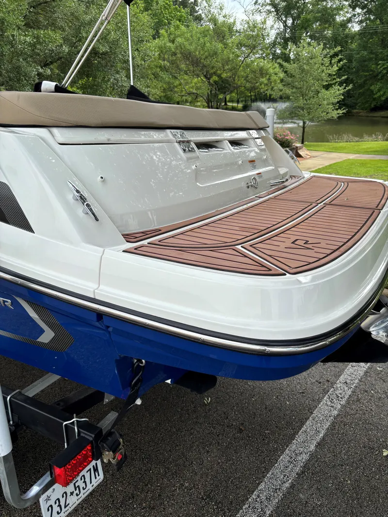 Slide: The Image of 2022 Bayliner VR6 Bowrider I/O boat with sleek design and spacious deck. - 4