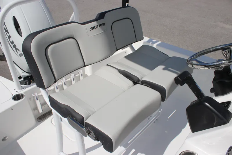 Slide: The Image of 2025 Sea Pro 202 CC boat seating with steering wheel, featuring modern design and comfort. - 10