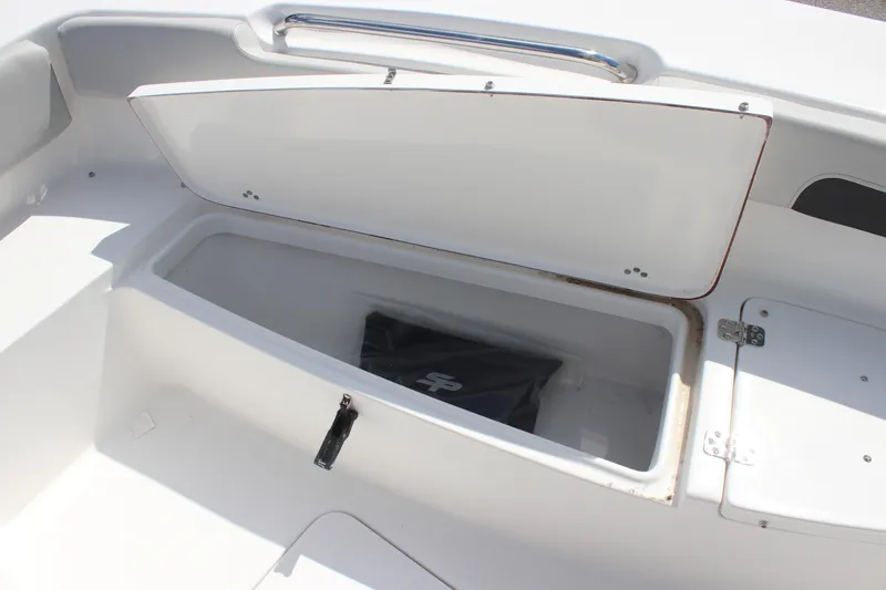 Slide: The Image of Open storage compartment on 2025 Sea Pro 202 CC boat. - 12