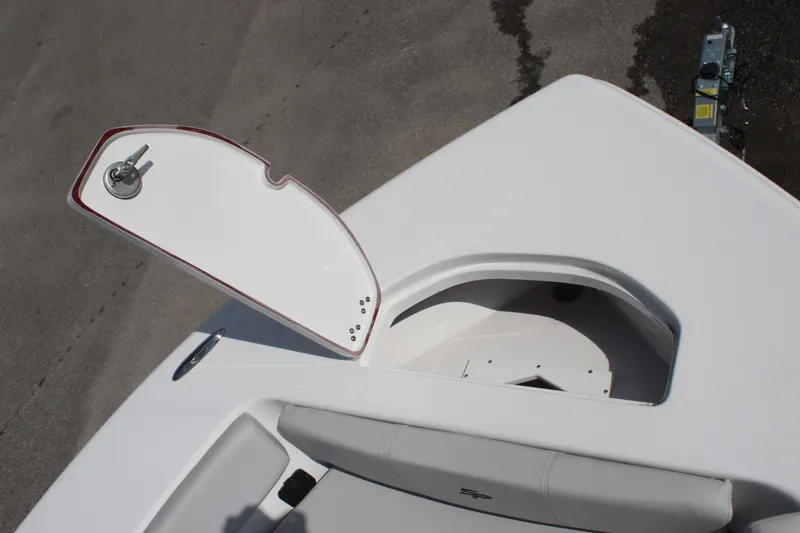 Slide: The Image of 2025 Sea Pro 202 CC boat with open storage compartment on deck. - 14