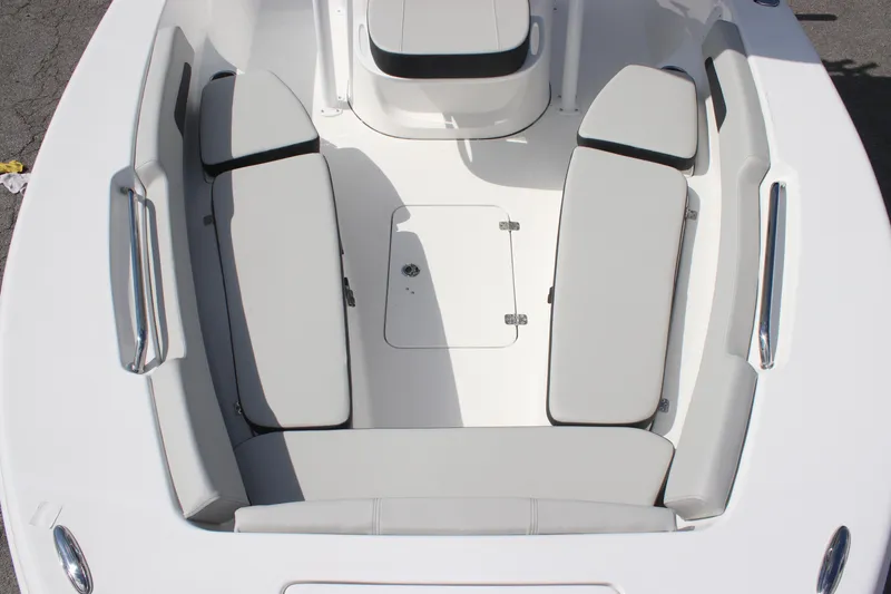 Slide: The Image of 2025 Sea Pro 202 CC boat interior with cushioned seating and storage compartment. - 15