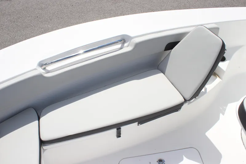 Slide: The Image of 2025 Sea Pro 202 CC boat interior with cushioned seating and sleek design. - 17