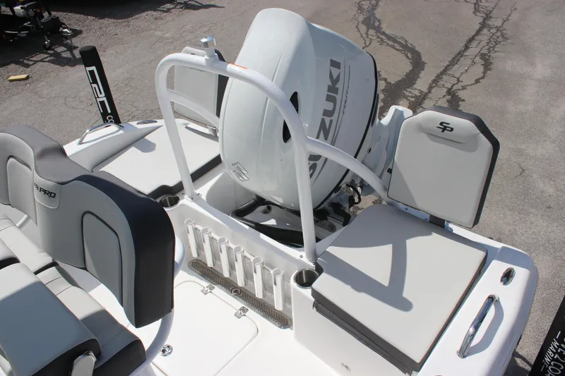 Slide: The Image of 2025 Sea Pro 202 CC boat with Suzuki outboard motor, featuring sleek seating and rod holders. - 18