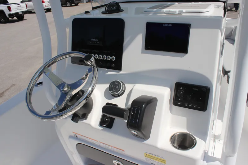 Slide: The Image of 2025 Sea Pro 202 CC boat console with steering wheel and modern controls. - 21