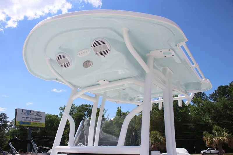 Slide: The Image of 2025 Sea Pro 202 CC boat T-top with speakers, set against a clear blue sky. - 8