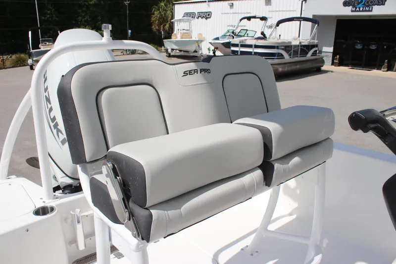 Slide: The Image of 2025 Sea Pro 202 CC boat seating with Suzuki engine in a marine showroom. - 9