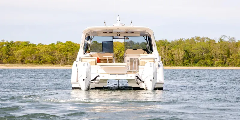 Slide: The Image of Aquila 36 Sport 2021 yacht on water, rear view with scenic background. - 11