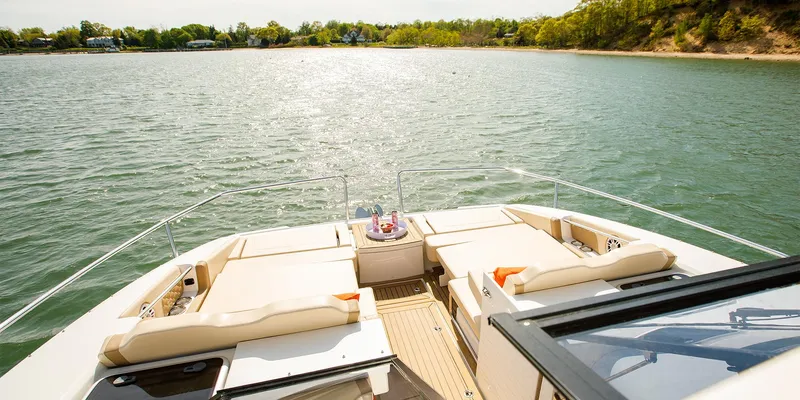 Slide: The Image of Aquila 36 Sport 2021 yacht with spacious deck and scenic water view. - 17