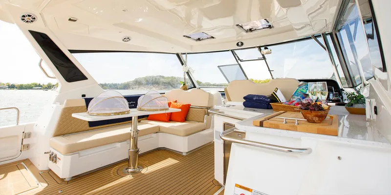 Slide: The Image of Interior of 2021 Aquila 36 Sport yacht with seating, table, and refreshments. - 21