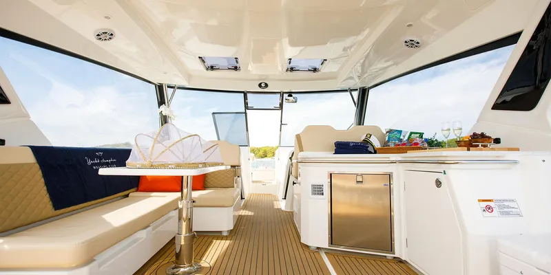 Slide: The Image of Interior of 2021 Aquila 36 Sport yacht with seating and kitchenette. - 23