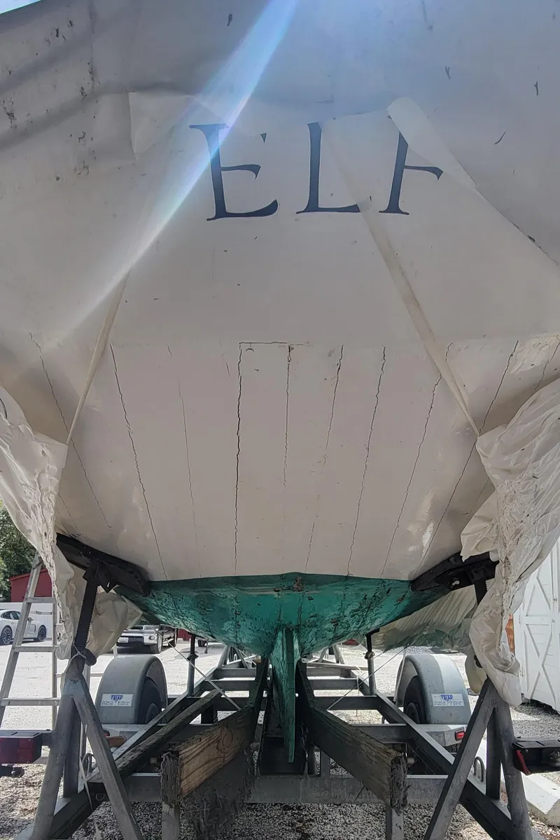 Slide: The Image of 1916 Herreshoff Buzzards Bay 15 sailboat on trailer, named "ELF." - 10