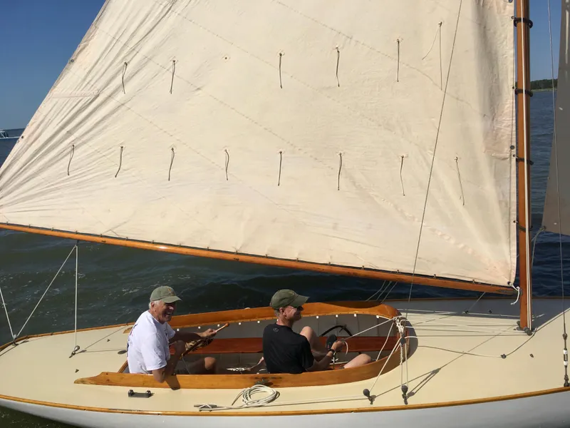 Slide: The Image of Sailing on a 1916 Herreshoff Buzzards Bay 15 with two people onboard. - 3