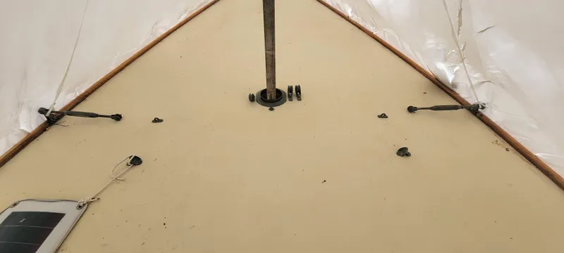 Slide: The Image of 1916 Herreshoff Buzzards Bay 15 sailboat deck with mast and rigging details. - 6