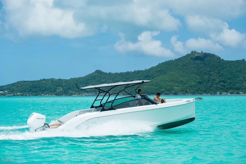 Slide: The Image of Modern Rand Supreme 27 boat cruising on turquoise waters, 2025 model. - 15