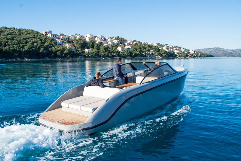 Slide: The Image of Modern Rand Supreme 27 boat cruising on clear blue water, 2025 model. - 20