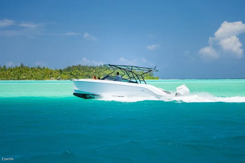 Slide: The Image of Modern Rand Supreme 27 boat cruising in turquoise waters, 2025 model. - 6