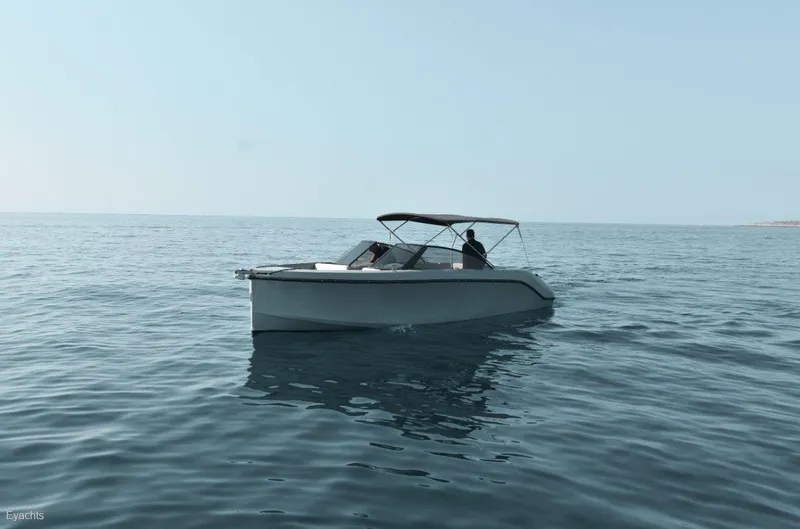 Slide: The Image of 2025 Rand Supreme 27 boat cruising on calm ocean waters. - 8