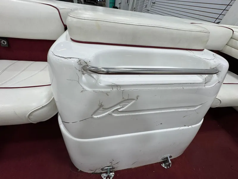 Slide: The Image of Cracked interior of 1997 Sea Ray 185 BR boat with white and red seating. - 10