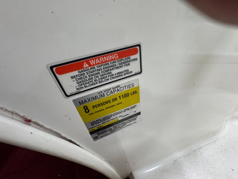 Slide: The Image of 1997 Sea Ray 185 BR warning label showing maximum capacity of 8 persons or 1100 lbs. - 18