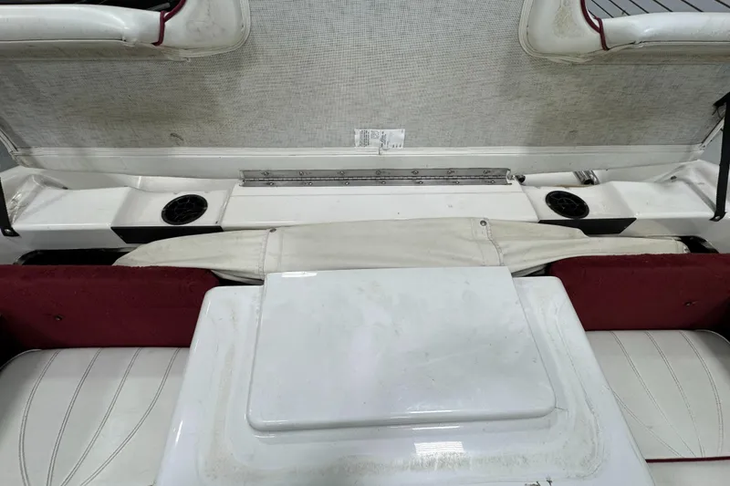 Slide: The Image of 1997 Sea Ray 185 BR boat interior with white and red seating. - 22