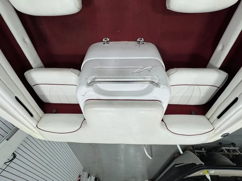 Slide: The Image of 1997 Sea Ray 185 BR boat interior with white and red seating arrangement. - 8