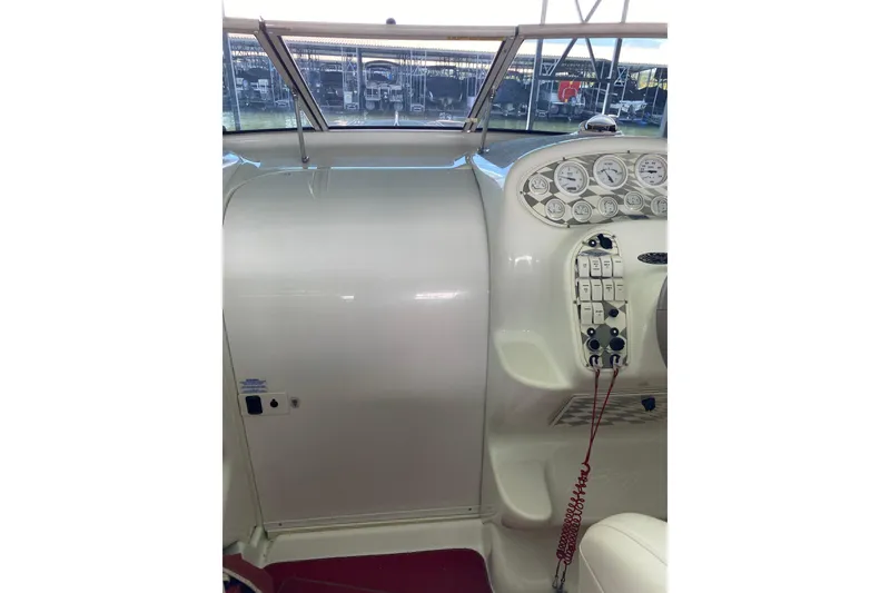 Slide: The Image of 1997 Baja 302 Boss boat dashboard with gauges and controls. - 17